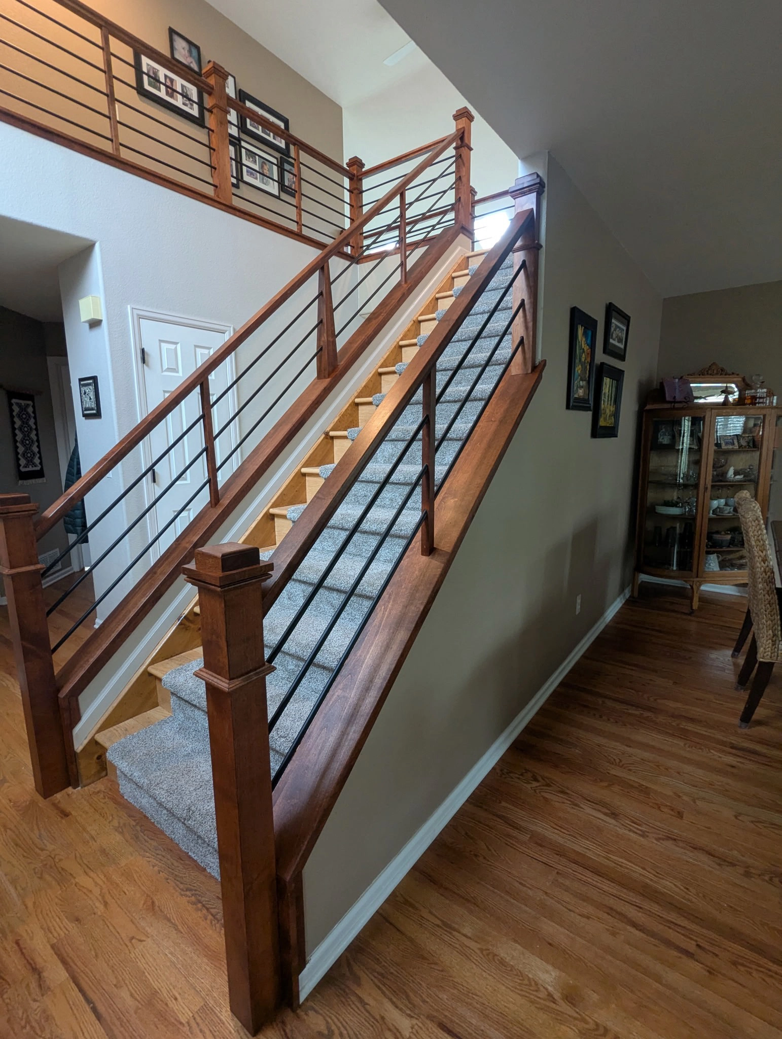 Horizontal alder railing design on interior stair remodel