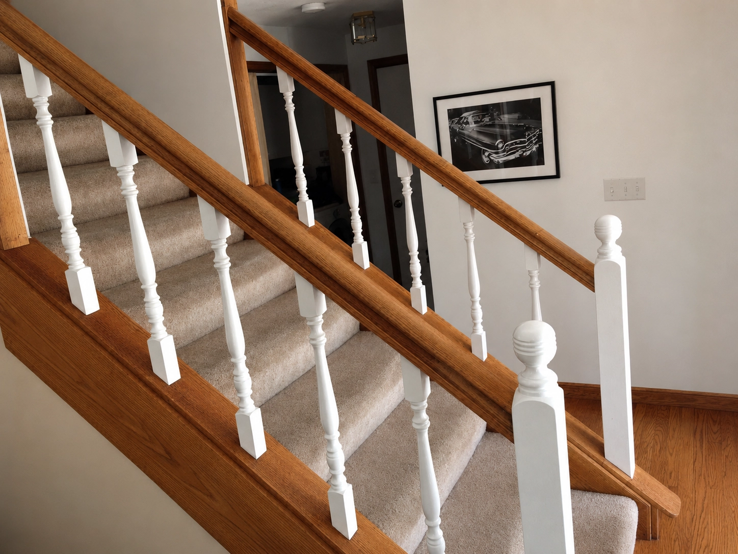 Before and after carpet to hardwood stair remodel in Denver home