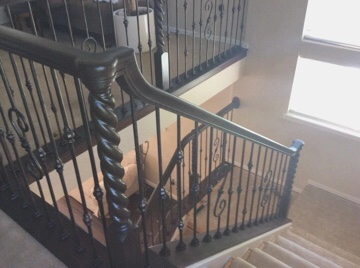 Stained newel post and handrail on interior stair remodel
